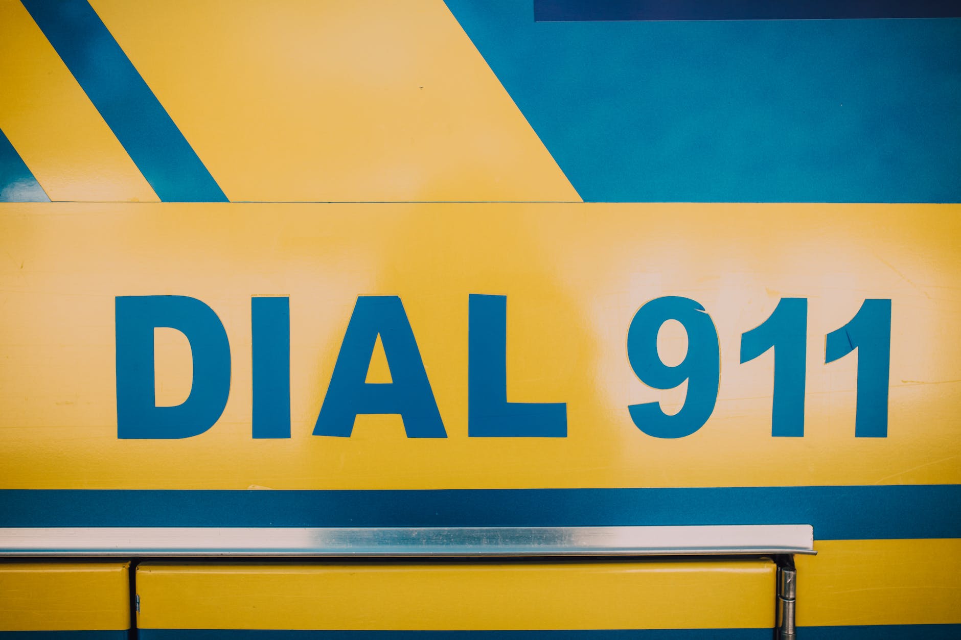 blue and yellow ambulance